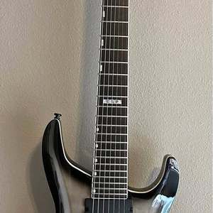 Cần đàn guitar điện <span class=keywords><strong>7</strong></span> dây thương hiệu Trades ESPÓ, thiết kế thân liền khối, mặt đàn làm bằng gỗ hồng sắc/gỗ maple/gỗ basswood, dây đàn 4 dây, sản xuất tại Portland Drone. - Product Image 1