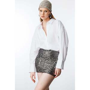 Mini-jupe décontractée en tissu satiné de soie tricoté avec paillettes, taille XS, style crayon, décorée de plumes, de nœuds et d'imprimés pour la saison printanière - Product Image 1