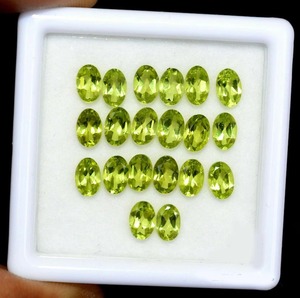 พลอยเพอริดอทดิบธรรมชาติประจำเดือนสิงหาคม รูปไข่สีเขียวเจียระไนเหลี่ยมเพชรพลอย ขนาด 5x7 มม. ผ่านการรับรอง เหมาะสำหรับการฝังเครื่องประดับ พร้อมเคลือบแว็กซ์/น้ำมัน - Product Image 1