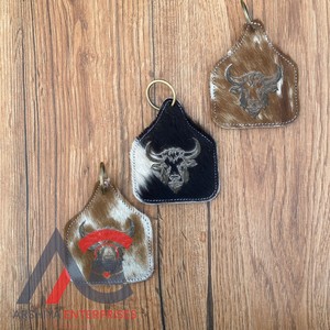 Porte-clés personnalisé en cuir de vachette véritable en relief au laser Porte-clés occidentaux en cuir de vachette de marque - Product Image 1