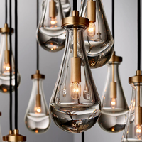 Lampes suspendues en verre en forme de goutte en laiton industriel pour des ambiances opulentes Escalier Villa Lustre Murano Personnalisable
