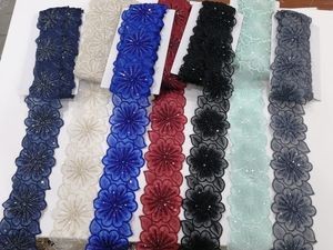 Tela de encaje bordado floral colorida vibrante y detallada con patrones intrincados, perfecta para la moda de alta gama - Product Image 2