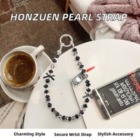 HONZUEN - Correa para Teléfono con Perlas y Cristales para Mujeres y Niñas, Correa Anticaída con Lazo Negro - Hecho en China