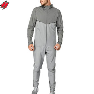 Vêtements de sport à blocs de couleurs OEM Ensembles de jogging unisexe avec veste zippée Ensemble deux pièces imprimé logo personnalisé Survêtements coupe-vent en nylon - Product Image 1