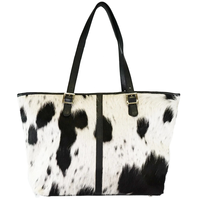 Sac fourre-tout en cuir de vache avec poignées en cuir noir et boucles dorées, motif blanc et noir