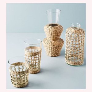 "Jarra tejida a mano inspirada en la naturaleza en ratán y algas marinas elegancia Bohemia decorativa con detalles de animales - Product Image 1