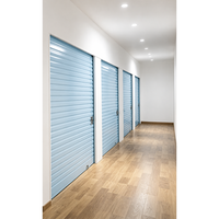 Système de stockage en acier avec porte enroulable bleue, verrouillable, résistant à la corrosion, pour entrepôt et atelier intérieur en tôle ondulée