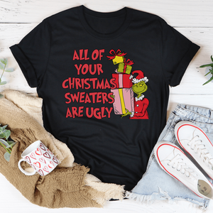 Camiseta Promocional con la Frase: Todos tus Suéteres Navideños Son Feos - Product Image 1