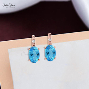 Productos de tendencia para vender 6x4mm Topacio azul suizo 14K Juego de puntas de oro sólido Pendientes de diamantes redondos Distribuidores al por mayor - Product Image 2
