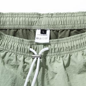 Pantalones cortos de playa atléticos de alta calidad para hombre, ropa de calle Lisa informal, tela de lona con patrón sólido ecológico, característica antiarrugas - Product Image 5