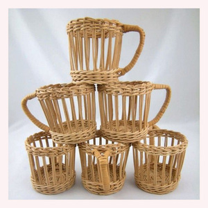 "Bohemian <b>Spirit</b> Handwoven Rattan & Seagrass Jug Holder with Detailed Animal A Luxe Decorative Accent for Artistic Living - Product Image 3