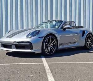 รถปอร์เช่ 911 Turbo S Cabriolet AWD ปี 2024 สีเงินเมทัลลิก GT พร้อมแพ็คเกจพาวเวอร์  เกียร์อัตโนมัติ  ล้อแม็กซ์สีดำมือสองขนาด R17  เบาะหนัง - Product Image 1