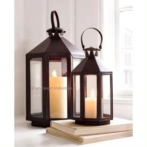 Linterna tradicional de metal y vidrio con acabado negro para el hogar y la iluminación navideña Linterna de vela colgante decorativa - Product Image 4