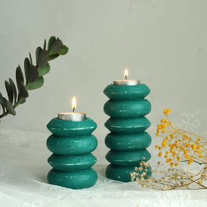 Hand-carved wooden owl-<b>shaped</b> taper <b>candle</b> holders with detailed feather and facial carvings, available at wholesale prices. - Product Image 2