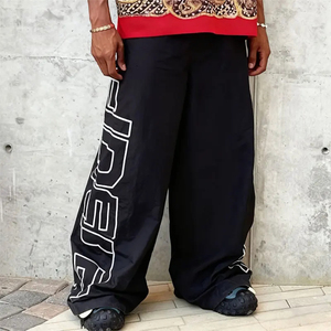 Nouveau pantalon baggy en nylon 2026 avec ceinture élastique, ceinture réglable, fermeture éclair et bouton, poches, jambe large, couleur noire - Product Image 1