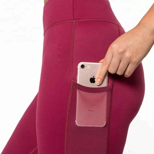 Vente en gros de Offre Spéciale taille haute Pantalon de yoga rouge personnalisé pour femmes avec poche latérale Leggings de sport pour femmes avec poches pour téléphone - Product Image 1
