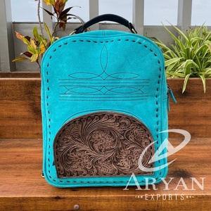 กระเป๋าเป้หนังนิ่มสีเทอร์ควอยส์2024ขายดีกระเป๋าสะพายหลังสไตล์ตะวันตกแกะสลักหนังแบบซ่อนใช้ได้ทั้งชายและหญิง - Product Image 1