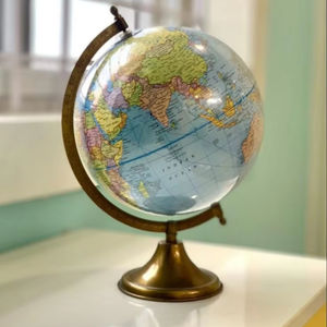 Antique finished metal globe sculpture with openwork design and sturdy base perfect for classic and rustic style rooms - Product Image 1