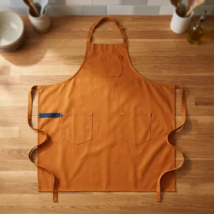 Delantal Clásico Resistente y Reutilizable de Lona Naranja con Múltiples Bolsillos para Limpieza y Uso Diario - Product Image 1