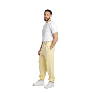 Sentez la chaleur avec ces pantalons de survêtement en polaire pour homme, jaune clair, avec bas élastiques, doux, pour l'entraînement et les loisirs - Product Image 2