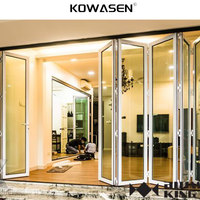 Porte de grange moderne en verre et aluminium pliable invisible pour usage extérieur