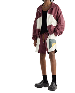 2025 nuevo diseño de chaquetas universitarias para hombres logotipo personalizado tela de satén cortavientos conjunto de pantalones cortos moda calle Jogger ropa deportiva invierno - Product Image 1