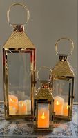 Lanternes métalliques décoratives antiques élégantes noires avec finition cuivrée, parfaites pour les intérieurs rustiques, les maisons de campagne