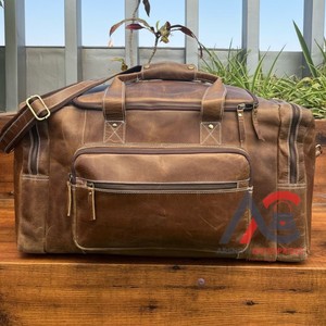 Duffle de gimnasio de cuero de grano completo, bolsas de lona de viaje para la noche, lona de mano de cuero de vaca con correa de hombro ajustable - Product Image 1