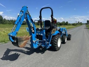 รถแทรกเตอร์ฟาร์ม LS Blue 4WD พร้อมอุปกรณ์ตักดินด้านหน้าและอุปกรณ์ขุดดินด้านหลัง รถแทรกเตอร์ล้อหลายฟังก์ชั่น - Product Image 1