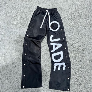 Pantalones de pierna ancha de nailon transpirable para hombre, botones laterales a presión, apliques estampados con logotipo personalizado, parche bordado, diseño de cordón de verano - Product Image 3