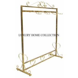 Portaequipajes de metal elegante y resistente con acabado de cromo pulido adecuado para habitaciones de hotel de lujo y áreas de invitados - Product Image 1