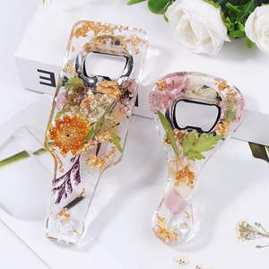 Resin and metal bottle opener featuring hand painted accents and traditional shape for classic home or bar decor - Product Image 2