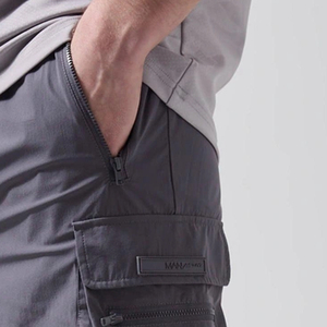 Shorts décontractés pour hommes, coupe confortable et respirante, coupe classique et décontractée, fermeture à boutons, avec poches latérales, vente en gros - Product Image 4