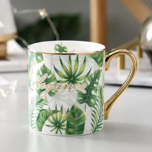 Taza de Té y Café de Porcelana China con Diseño de Hojas Verdes Estilo Nórdico, Borde Dorado, Asa Dorada, Filtro de Hojas de Té Dorado, Capacidad de 450-500 ml, Cuchara - Product Image 1