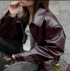 Trendy <b>black</b> oversized <b>leather</b> bomber jacket with slouchy sleeves, styled with high-waisted beige pants, at wholesale prices. - Product Image 5