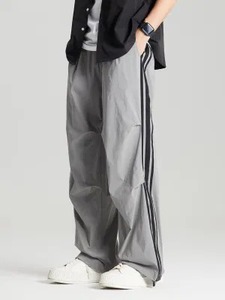 Pantalones de nailon transpirables unisex, venta al por mayor, de talla grande, impermeables, sueltos, a rayas, holgados, de gran tamaño, para correr, de pierna ancha, laterales - Product Image 4
