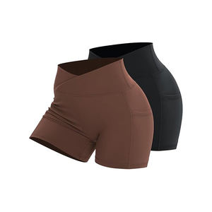 Pantalones cortos de gimnasio de moda para mujer, pantalones cortos de yoga activos de cintura alta con bolsillos laterales, cierre elástico de poliéster 100%, patrón sólido - Product Image 1