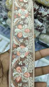 custom made floral embroidered in several colour ways on <b>net</b> base <b>fabric</b> for dresses and ladies wear in 2 inch width. - Product Image 5