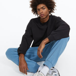 OEM personalizado negro pantalones de correr de gran tamaño para los hombres de moda de invierno de pista de sudor con cremallera hecha de lona - Product Image 3