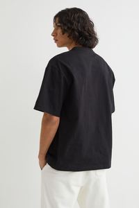 เสื้อยืดแขนสั้นใส่ได้ทั้งชายและหญิงผ้าคอตตอน100% มาใหม่พิมพ์ลายดอกไม้สีดำล้วน - Product Image 4