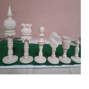 custom made hand carved white coloured bone chess set pieces hand made by artisans for chess players and chess product suppliers