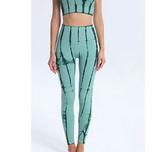 Leggings de yoga en fibre de bambou respirant de couleur unie pour femmes avec couleurs et logos personnalisables à la taille moyenne - Product Image 1