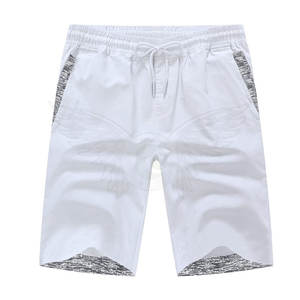 Logo personnalisé hommes décontracté coton Shorts conception OEM avec motif solide décoration poches pour course à pied vêtements actifs Pakistan - Product Image 1
