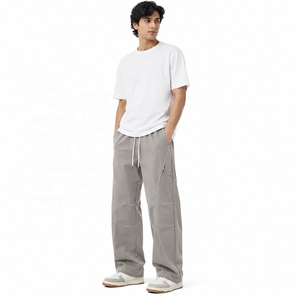 Pantalones deportivos de nailon arrugado con forro de malla interior, bolsillos laterales, antiarrugas, talla grande, corte holgado, estilo baggy para hombre. - Product Image 1