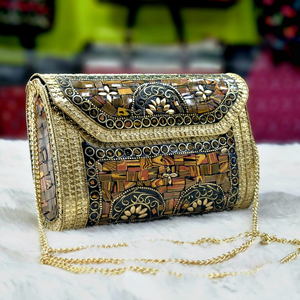 Ornate brass clutch with mosaic patterns and intricate gold details Available Wholesale Stock Garden Ornaments - Product Image 1