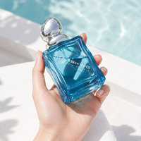 Flacon de parfum en verre ondulé 100 ml : Bocal à parfum effet vague d'eau avec bouchon boule argenté pour fragrance marine, marque privée, vente en gros