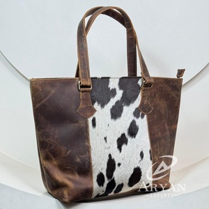 2025 nuevo diseño personalizado de alta calidad diseñador de cuero de vaca oculto bolsa de mano al por mayor bolsos de lujo de cuero genuino para mujeres - Product Image 1