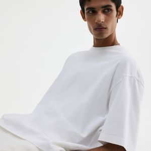 เสื้อยืดผู้ชายผ้าฝ้ายสีทึบทรงโอเวอร์ไซส์ - Product Image 1