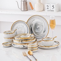 Service de table en porcelaine blanc veiné de marbre et bordé d'or, luxueux, résistant à la décoloration, idéal pour les mariages, les réceptions formelles et les cadeaux.