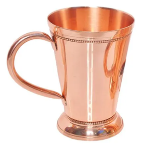 Footed copper mug with a subtle hammered texture and ribbed base, suitable for traditional drink serving at wholesale price - Product Image 4